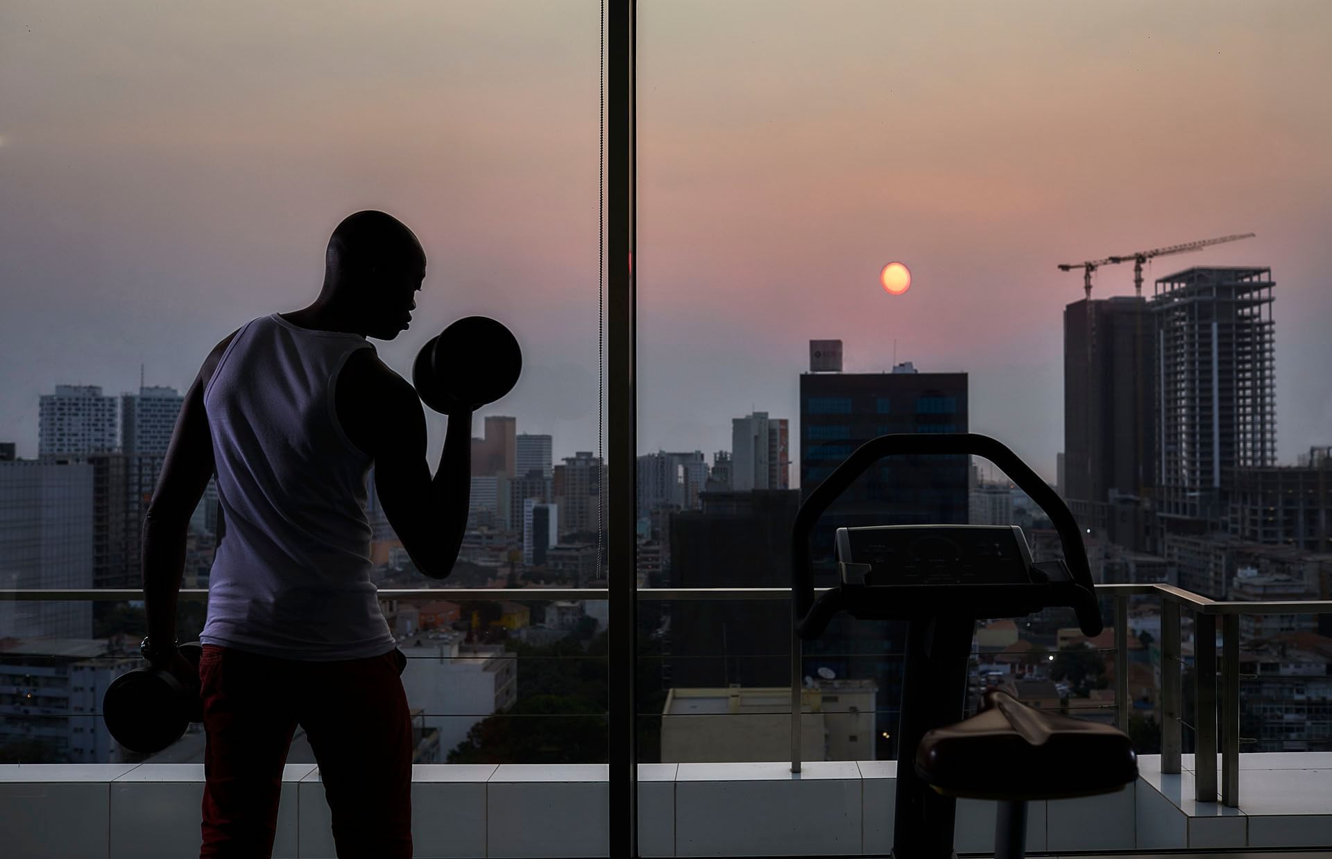 Gym with city view at RK Suite Hotel Luanda